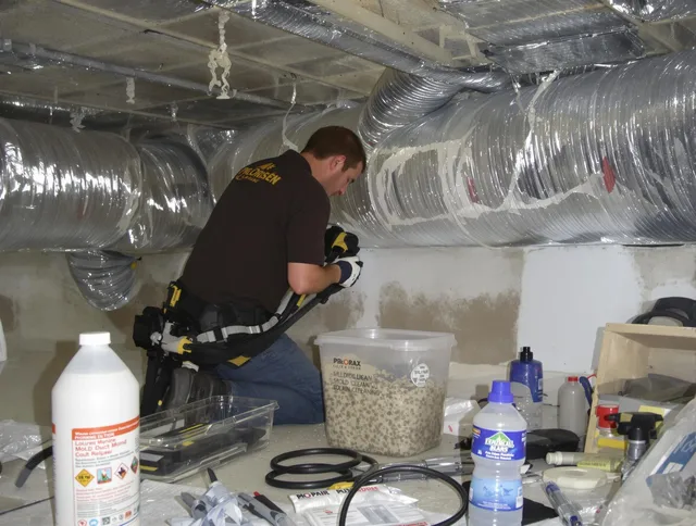 Burrillville Air Duct Cleaning specialist performing professional mold removal from air ducts in Burrillville