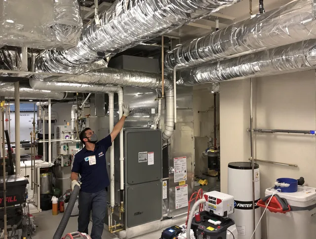 Burrillville Air Duct Cleaning specialist performing thorough furnace duct cleaning in a Burrillville residence