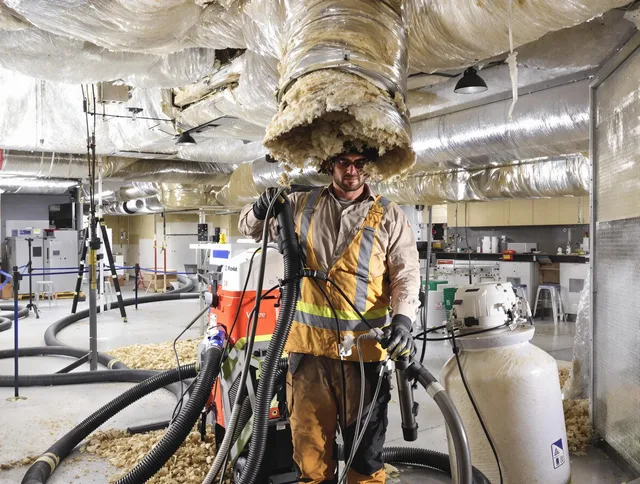 Professional vacuum insulation removal by Burrillville Air Duct Cleaning expert in Burrillville